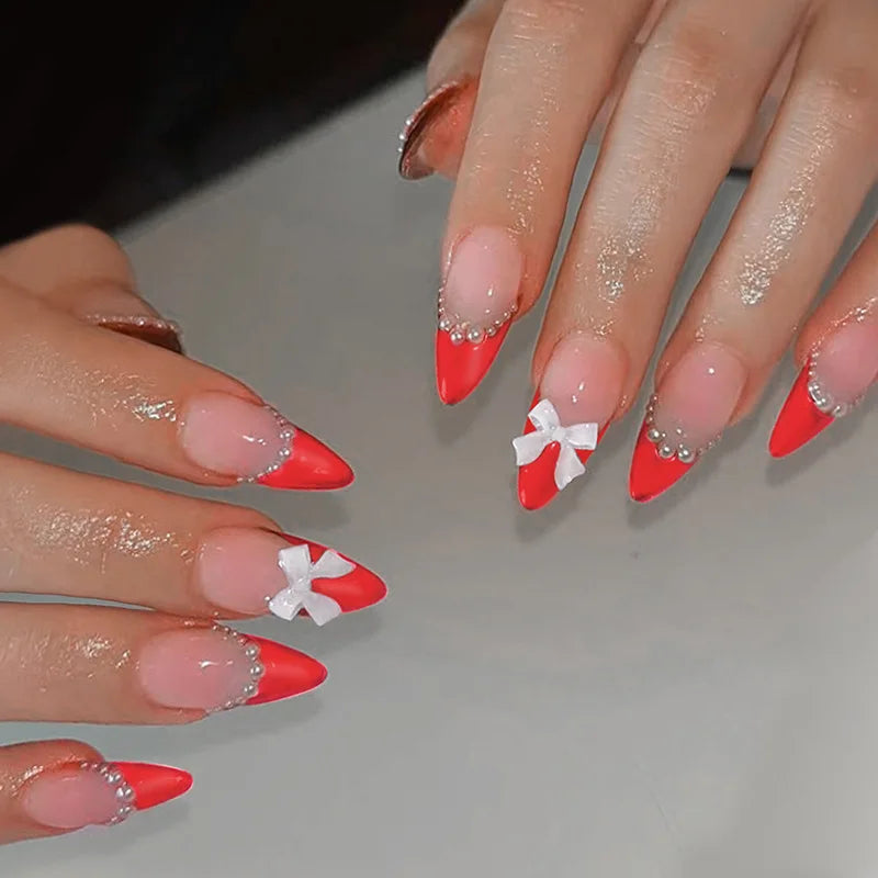Red French Tip Nails with Pearls and Bows Elegant Nail Art