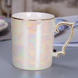 Mode-Kaffeetasse mit Perlenglasur und goldenem Griff, Regenbogen-glasierte Keramiktasse