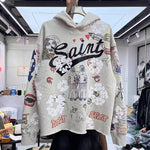 Graffiti High Street Worn Holes Retro Hoodie for a Loose and Edgy Loo